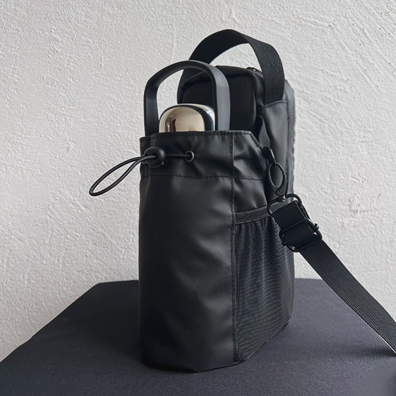 Black water bottle holder bag with bottle and shoulder strap